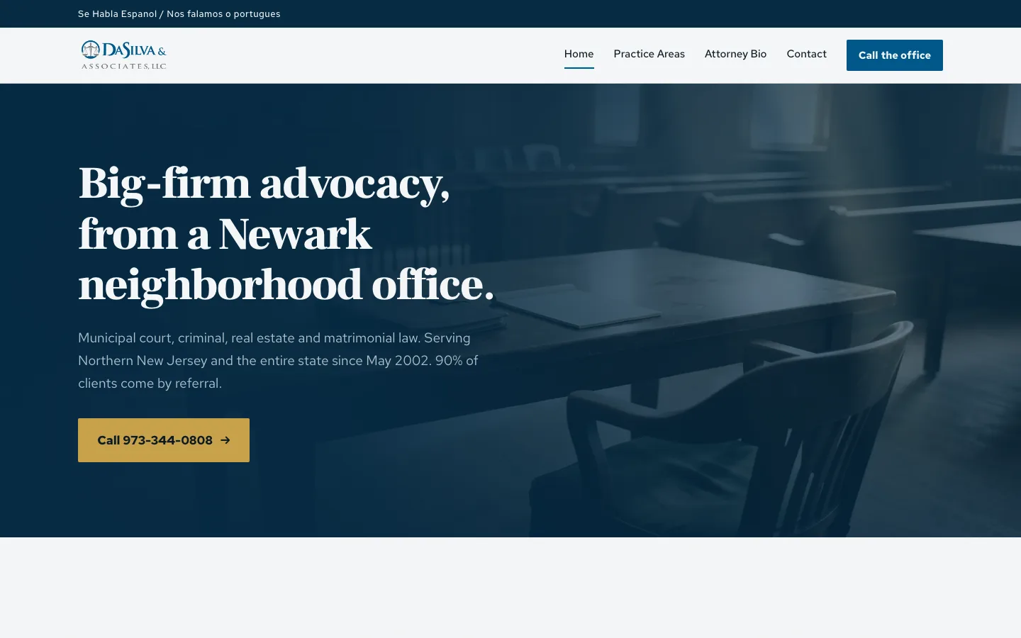 Screenshot of the Paul DaSilva Law website, a dark navy hero over an empty courtroom reading 'Big-firm advocacy, from a Newark neighborhood office'